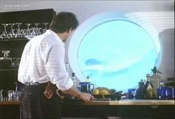 Barbara Carrera in a short skirt breasts 39