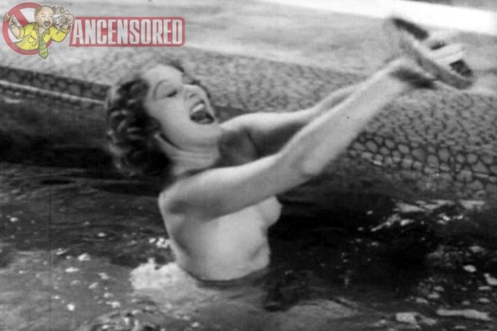 Edwige FeuillRe in a skirt