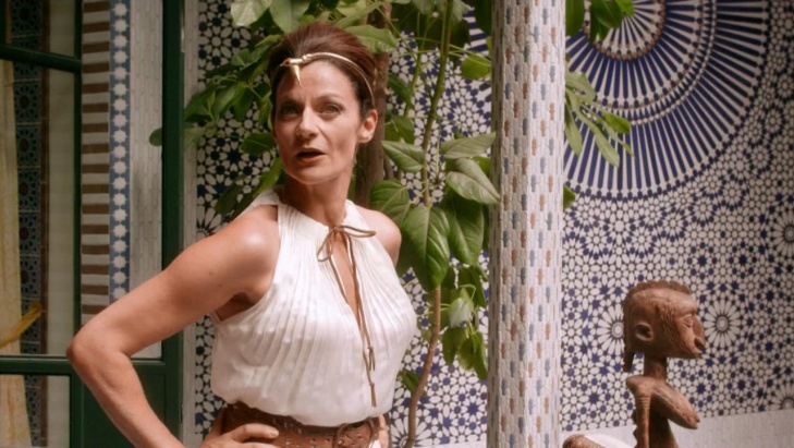 Michelle Gomez in a short skirt breasts