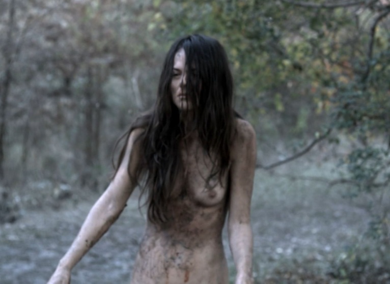 Sarah Butler in a skirt